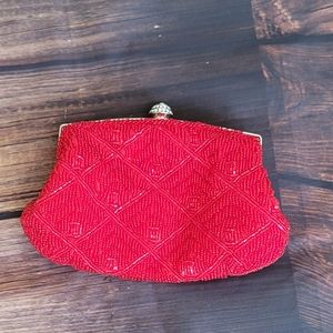 A red beaded clutch.